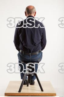 Sitting pose blue deep shirt jeans of Ed 0003